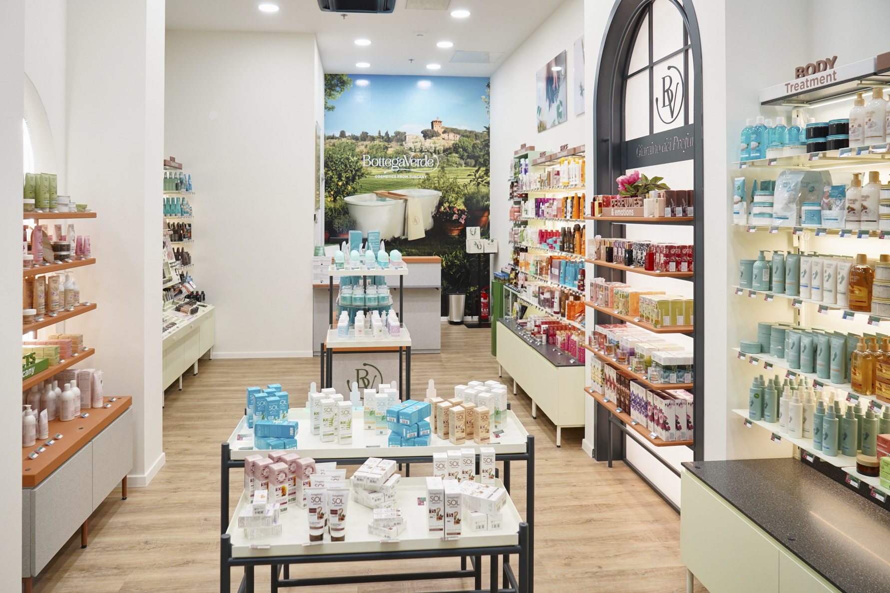 A bright retail space showcasing various beauty and skincare products on shelves and tables.