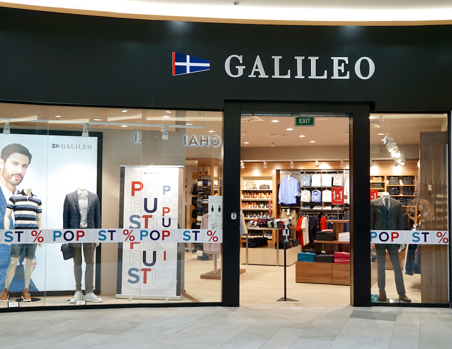 A storefront for "Galileo" featuring clothing displays and promotional signage.